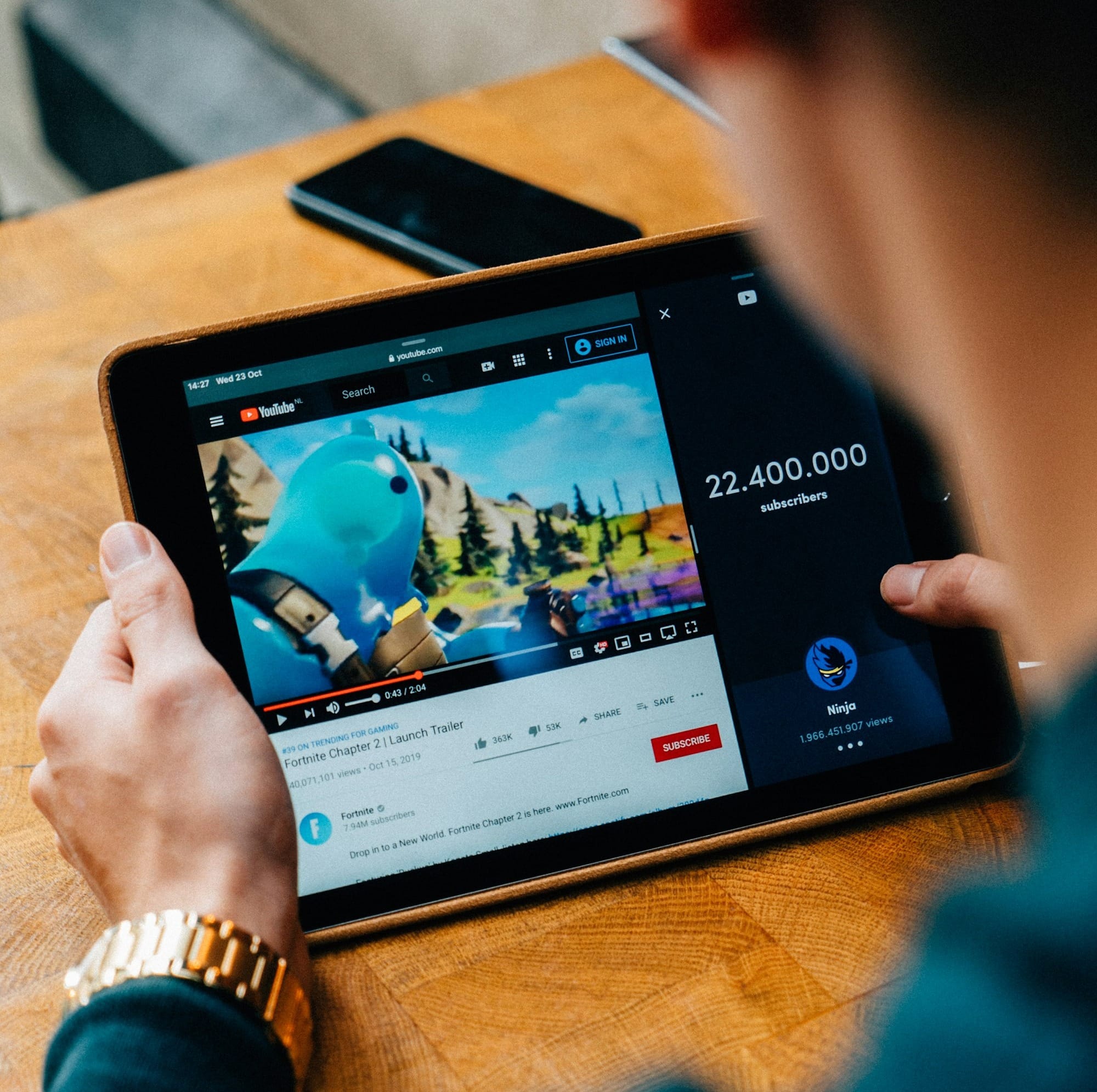 selective focus photography of person using tablet computer