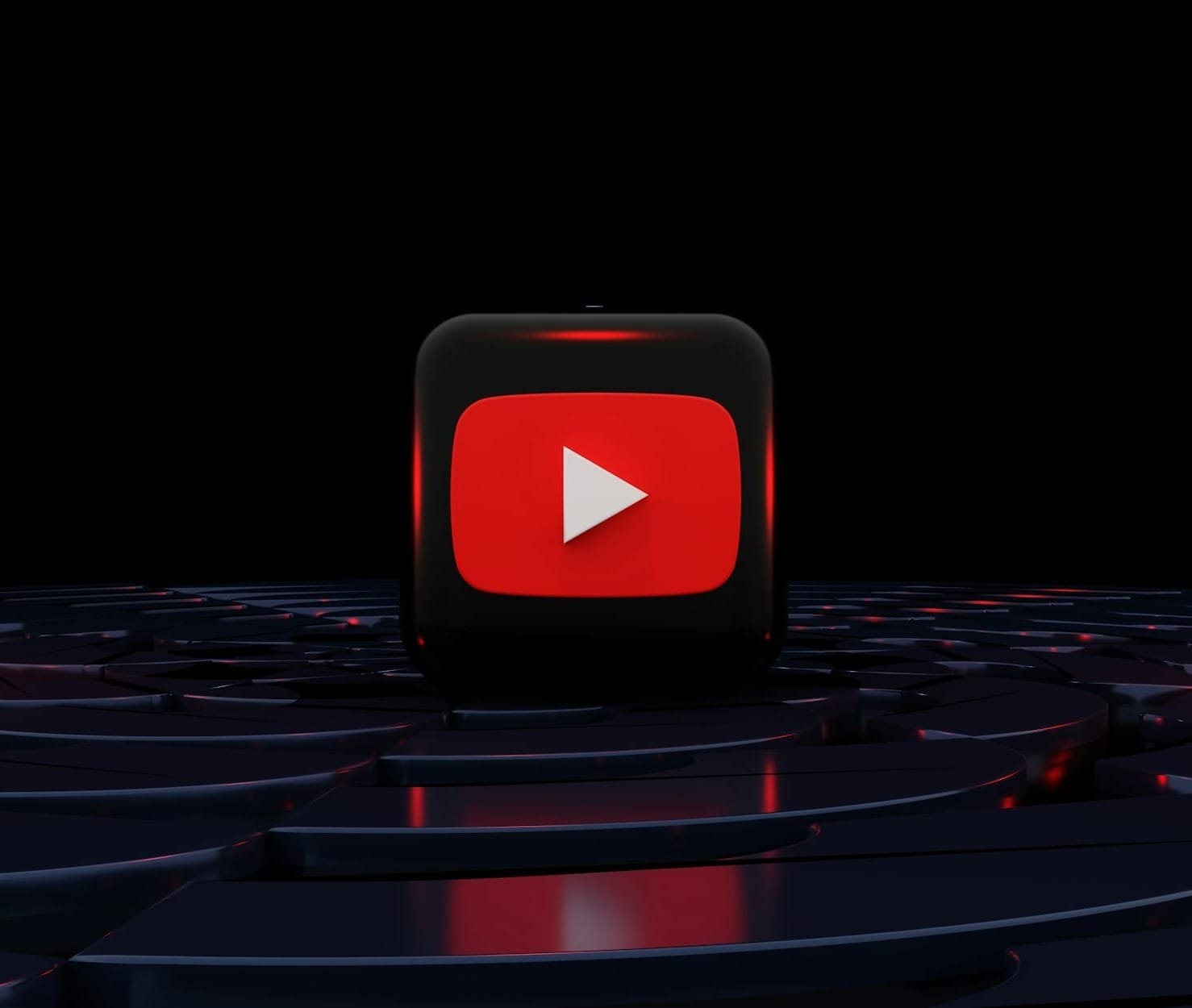 a red play button on a black background